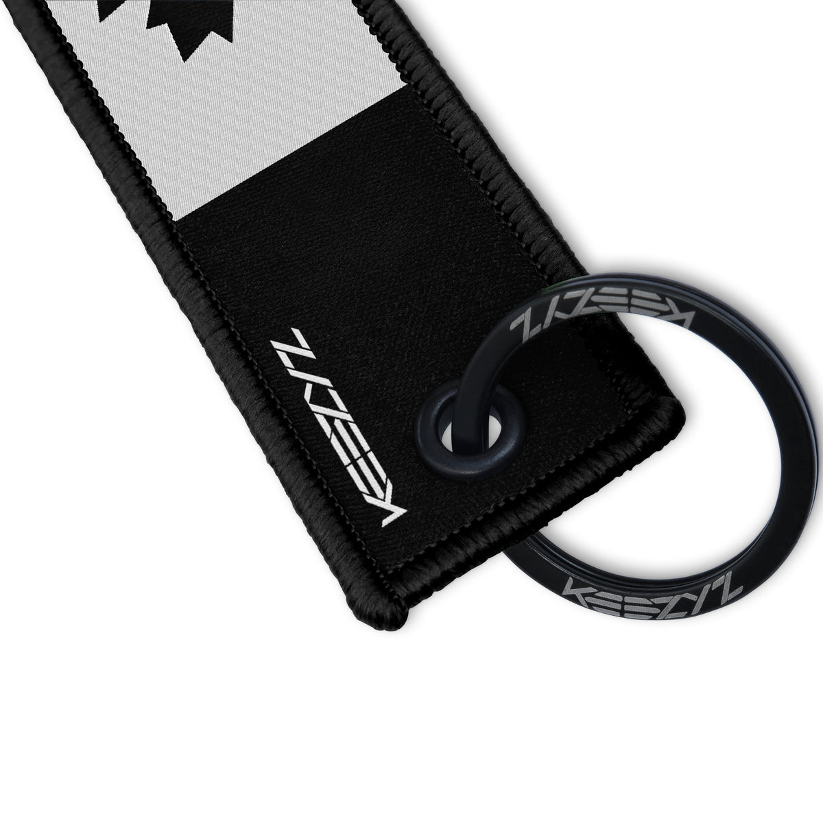 Close-up of the Keezyz Canada Flag Blackout keychain with Black border
