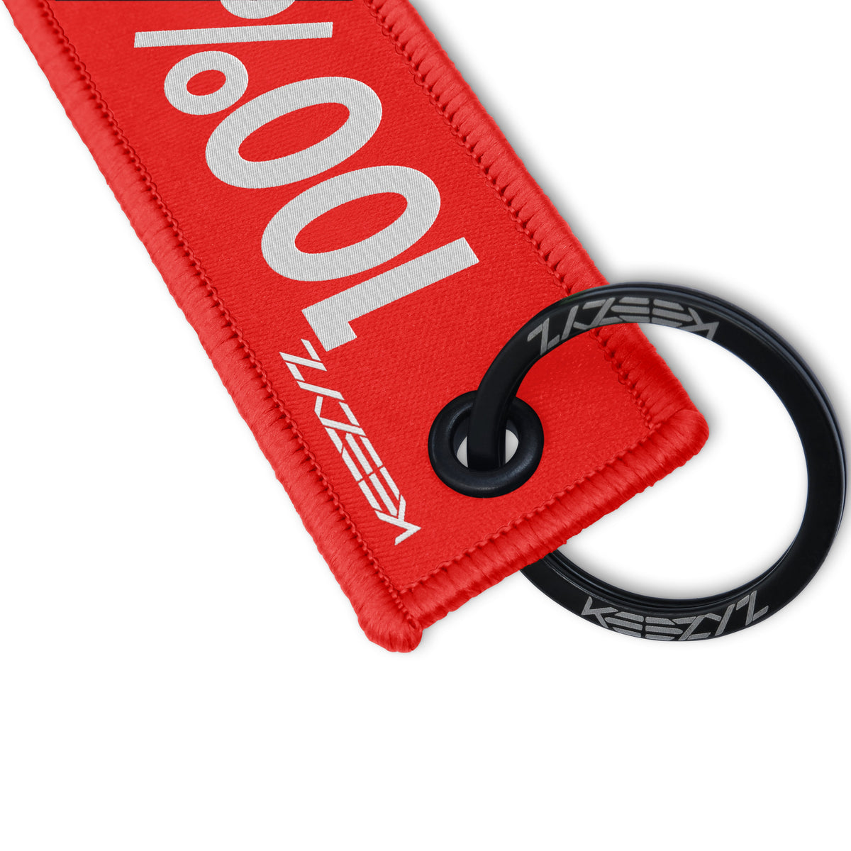 Close-up of the Keezyz 100% Savage keychain with Red border