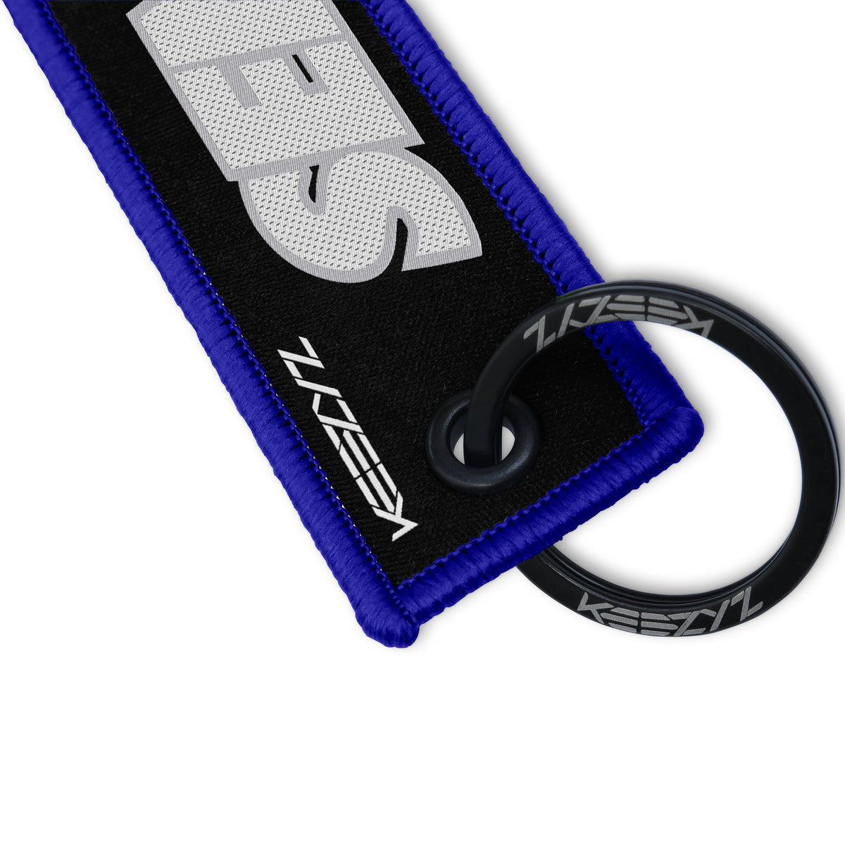 Close-up of the Keezyz Send It keychain with Blue border
