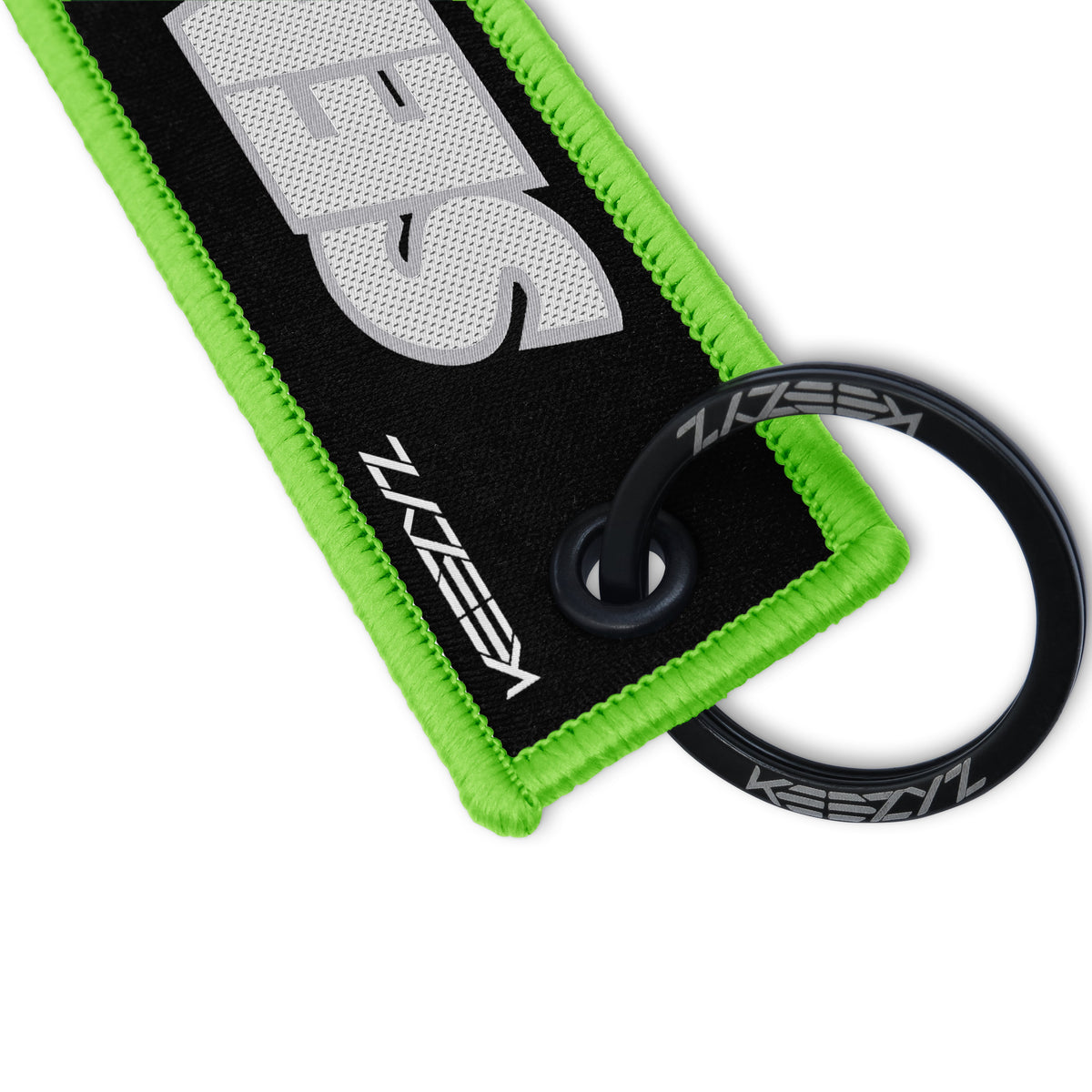 Close-up of the Keezyz Send It keychain with Green border