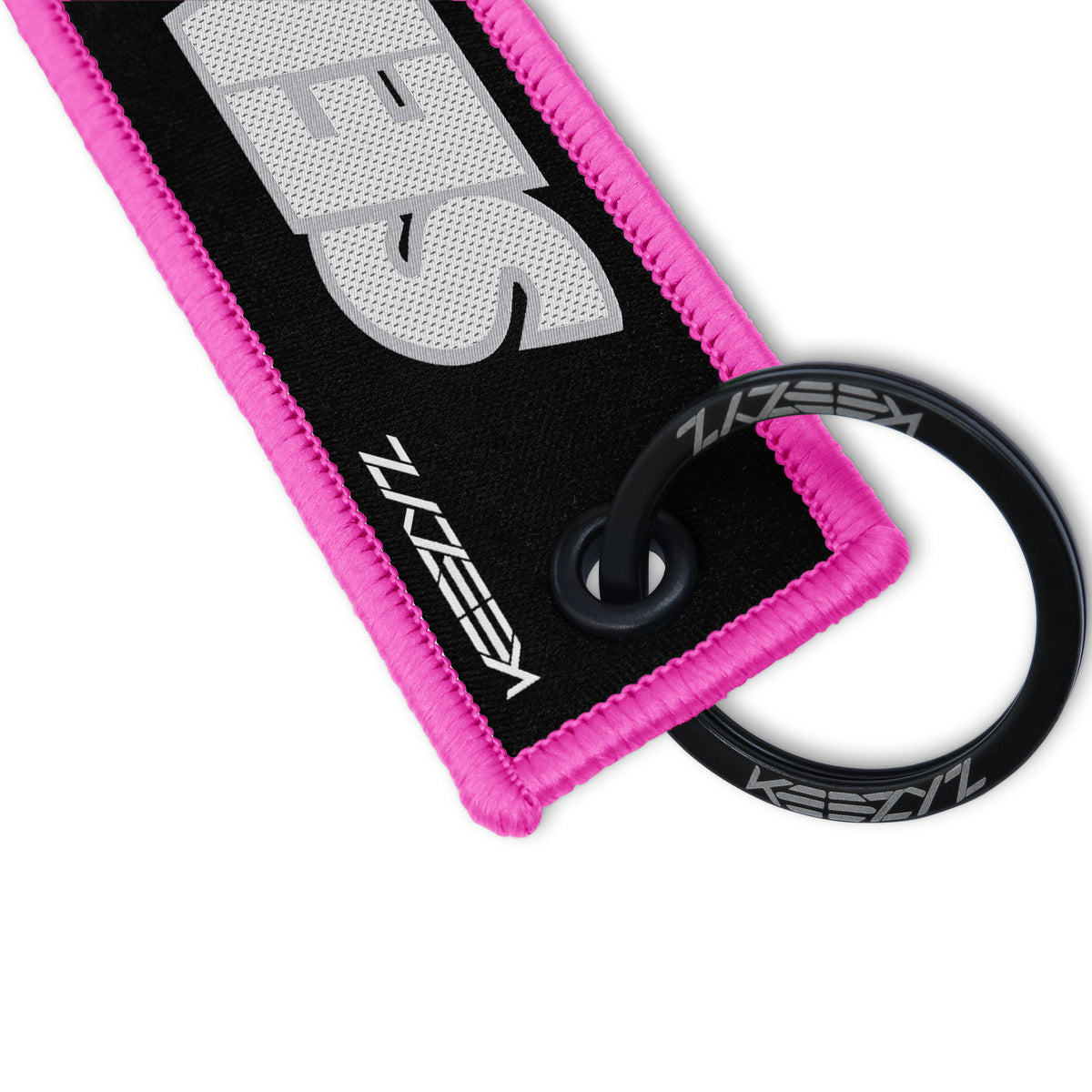 Close-up of the Keezyz Send It keychain with Pink border