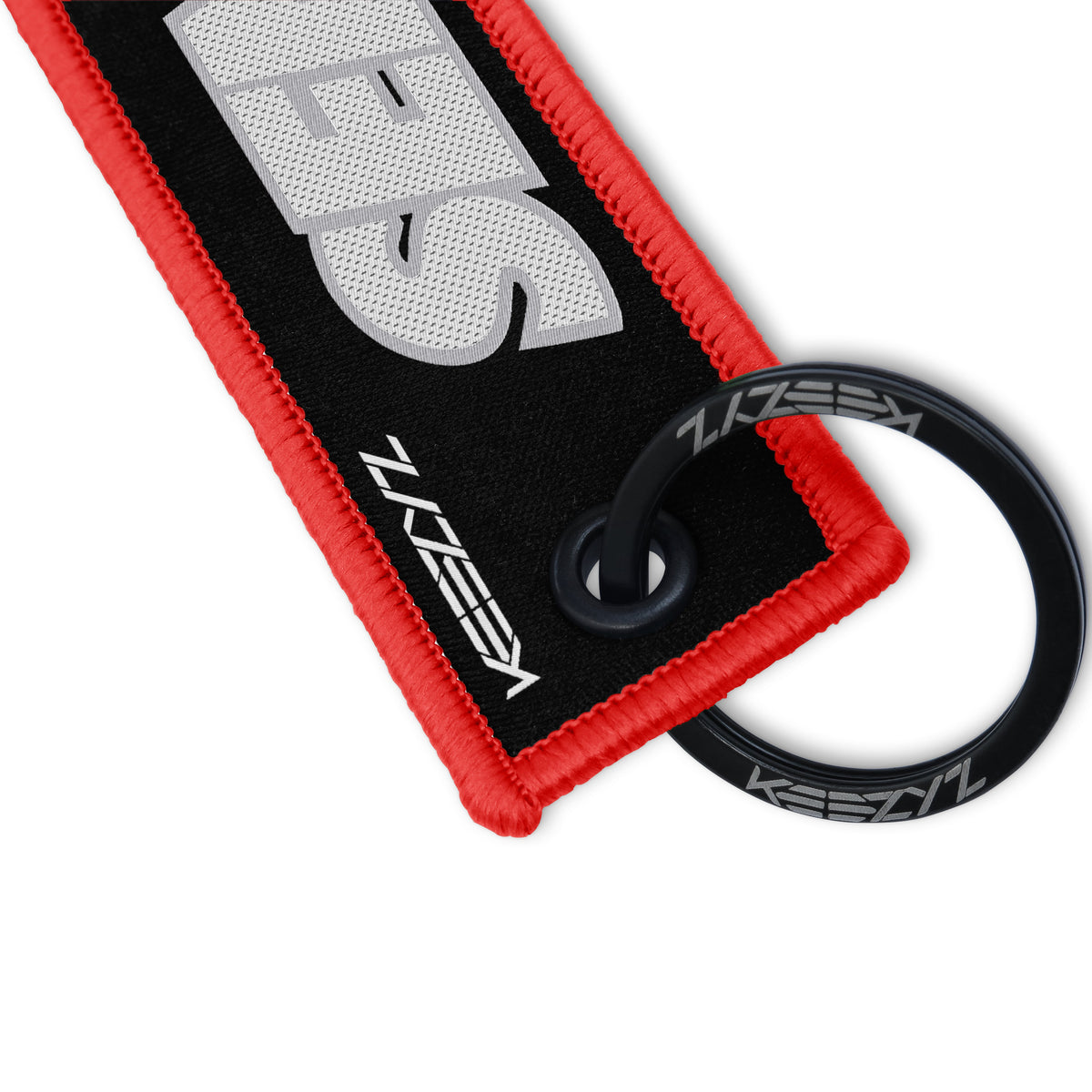 Close-up of the Keezyz Send It keychain with Red border